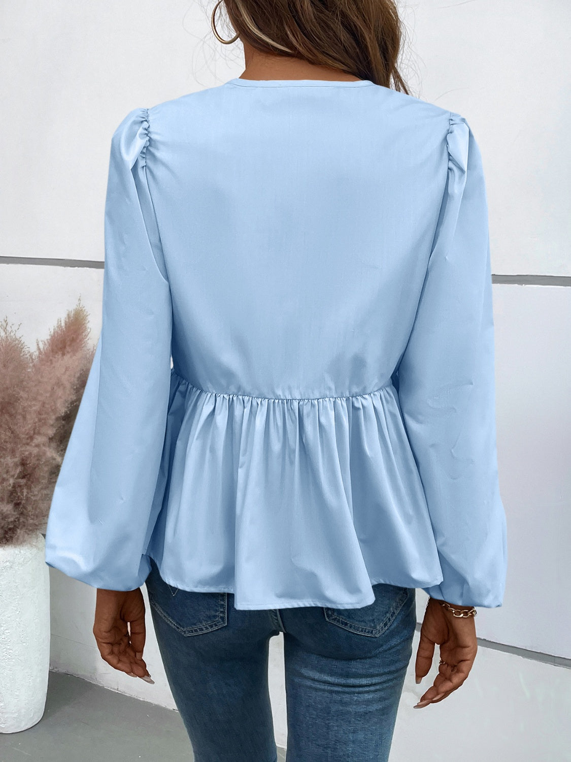 Leopard Peplum Tied Long Sleeve Blouse