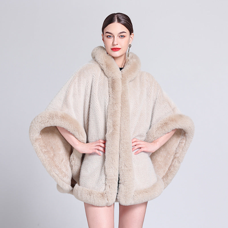 Woman wearing a beige fur cape