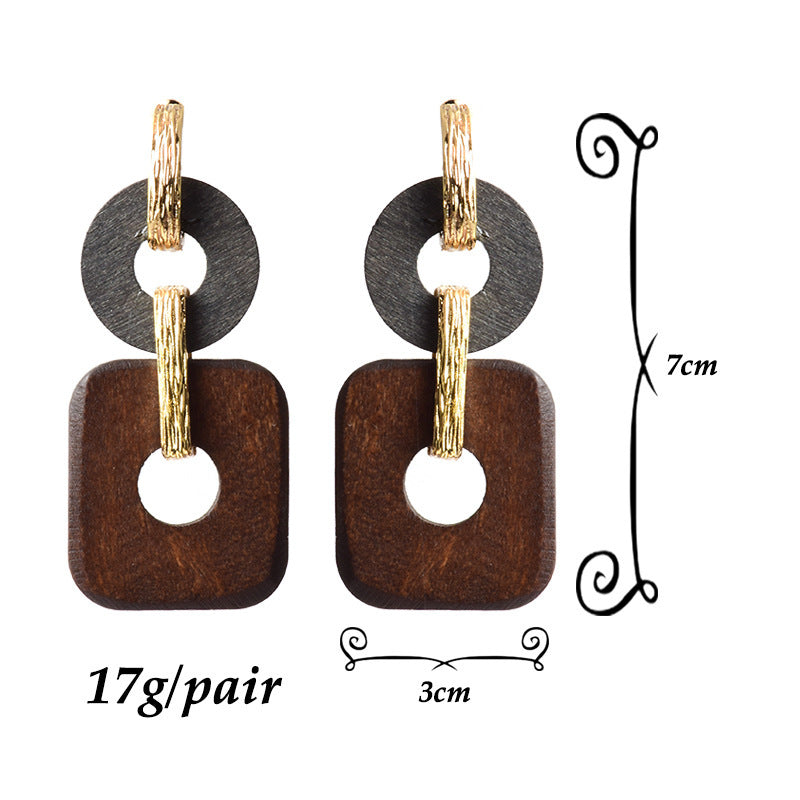 Wooden earrings with gold accents, shown with measurements on a white background.