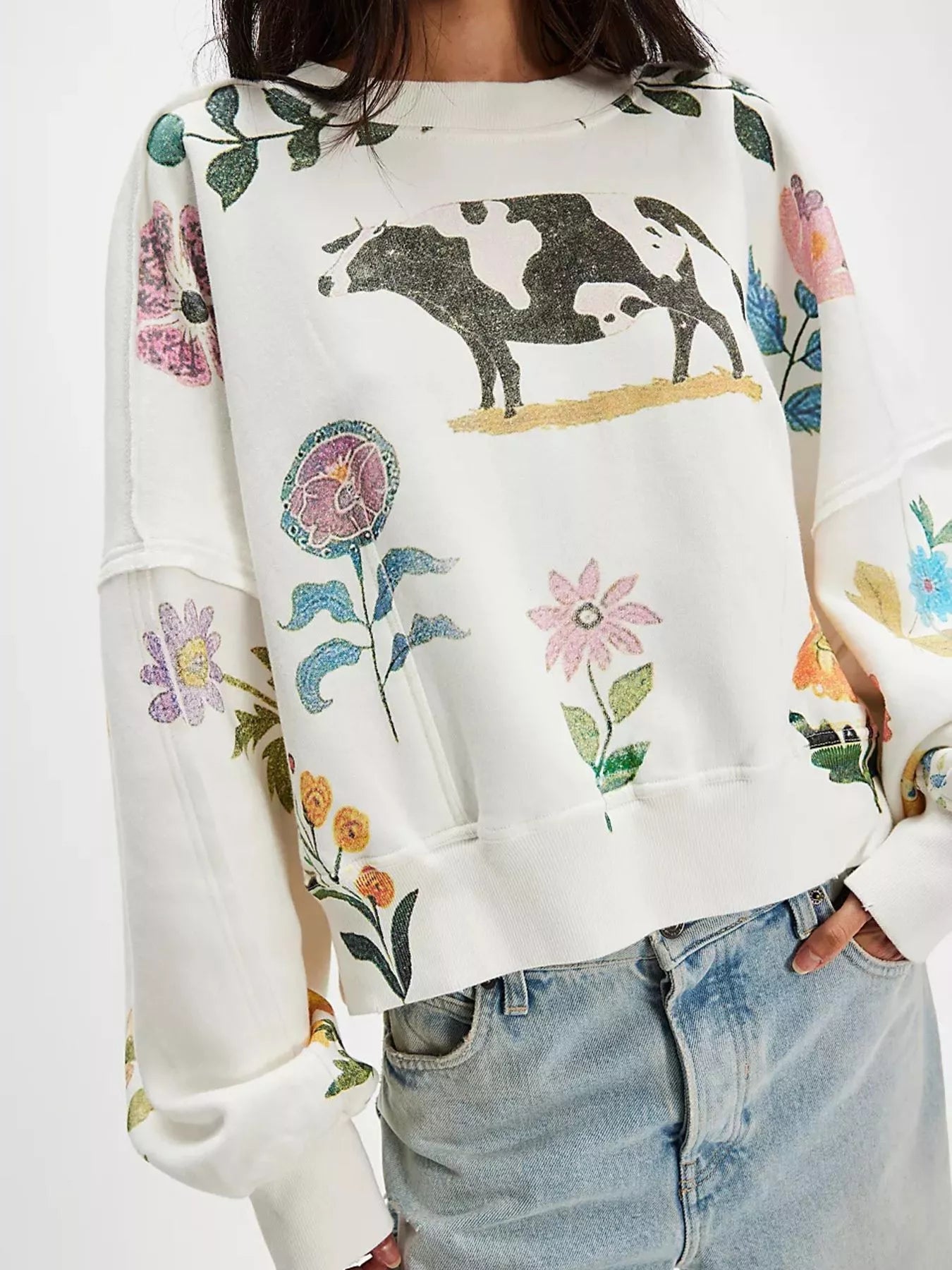 White sweatshirt with cow and floral design 