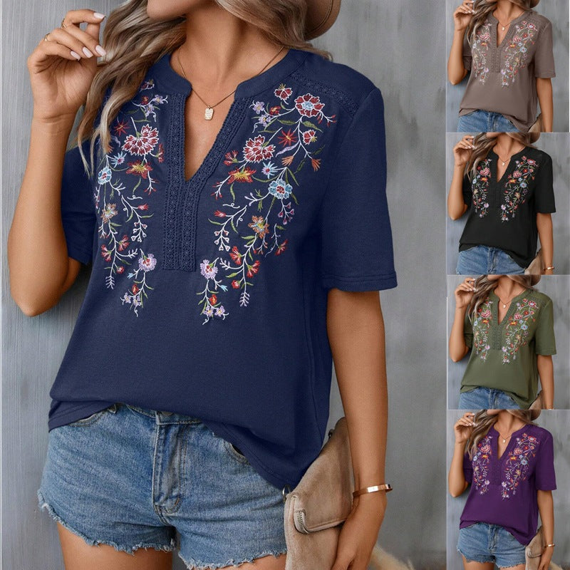 Navy blue embroidered knit top worn by a model with color options displayed.