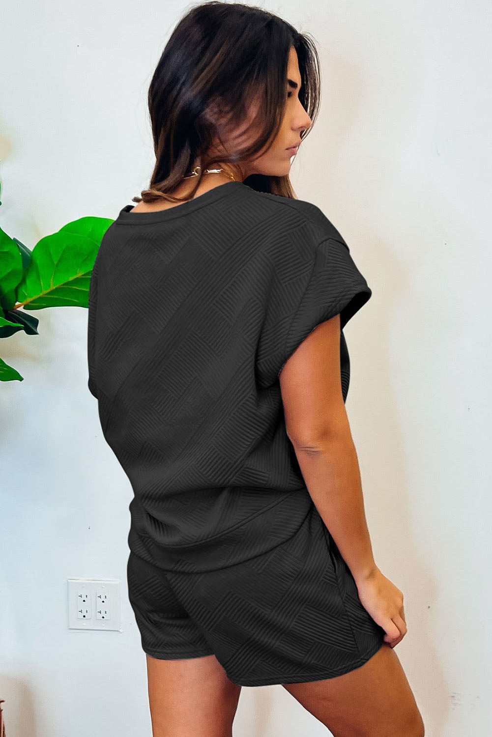 Back of Plain Textured Black Short Sleeve Top and Shorts