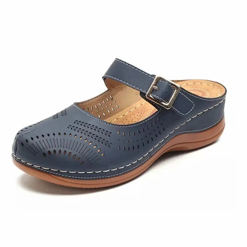 Navy blue clog shoe with a brown sole