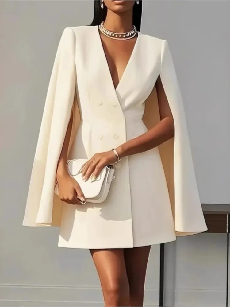 Woman wearing a white cape dress 