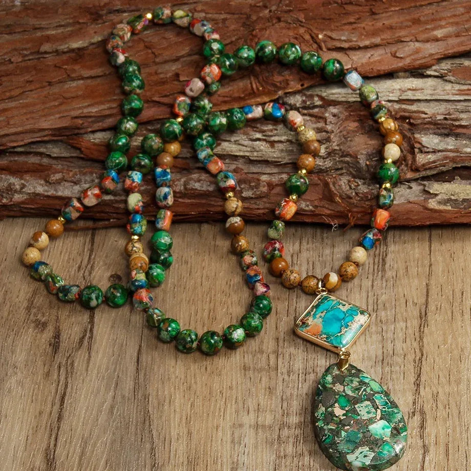Colorful beaded necklace with a pendant on a wooden surface