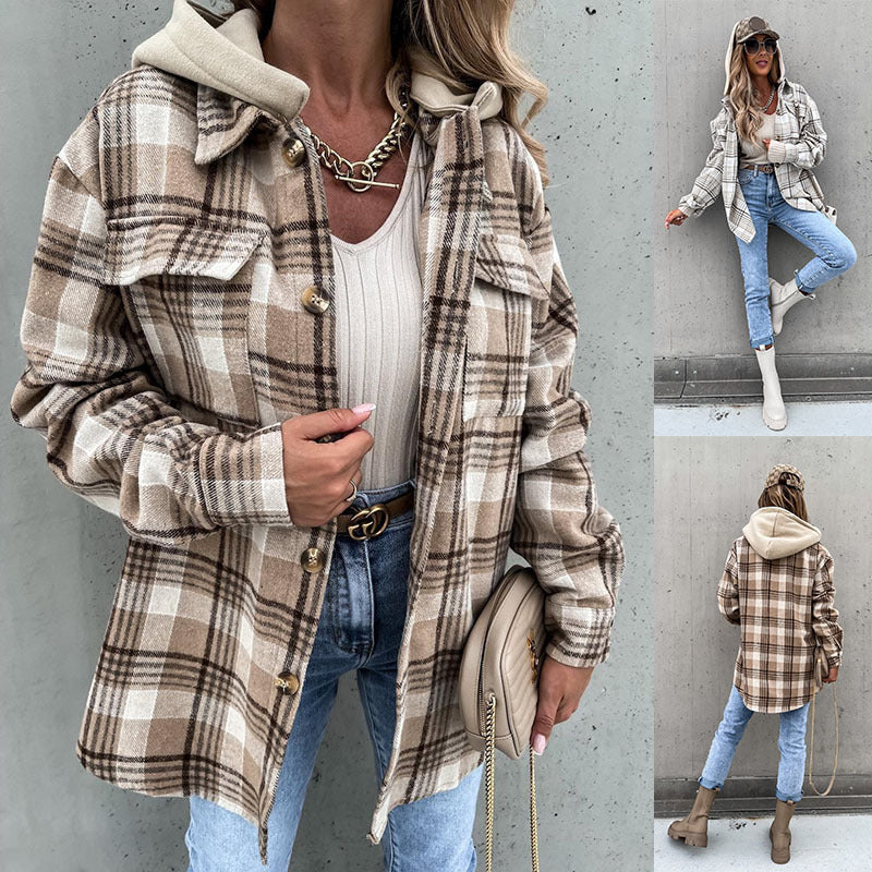 Woman wearing a plaid jacket with a neutral background