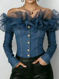 A woman wearing a blue denim off-the-shoulder top with sheer mesh ruffle sleeves, gold-tone buttons down the front, and black leather pants, shown from the neck to the hips against a plain light background.