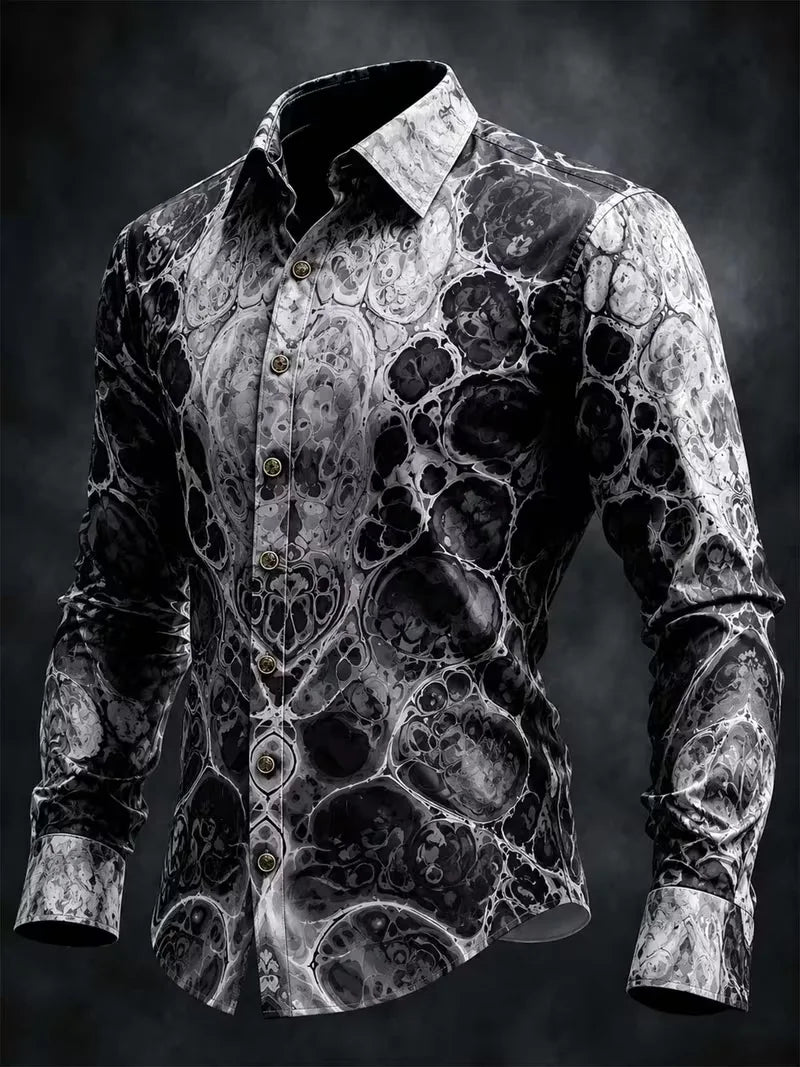 A men's long-sleeve button-up shirt with a black and white marble or lava-like abstract pattern, shown on a dark studio background.