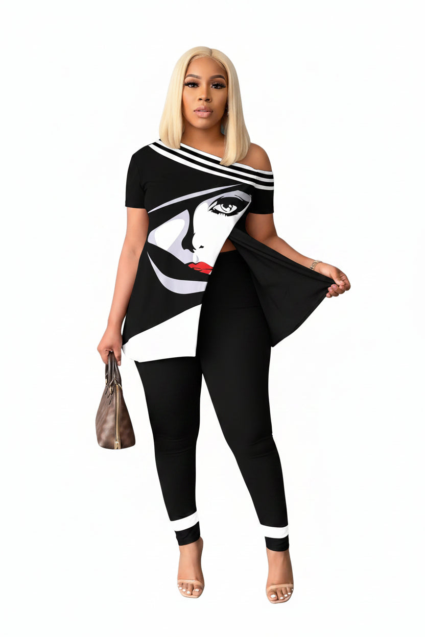 Woman wearing a black and white outfit with graphic design, standing against a gray background.