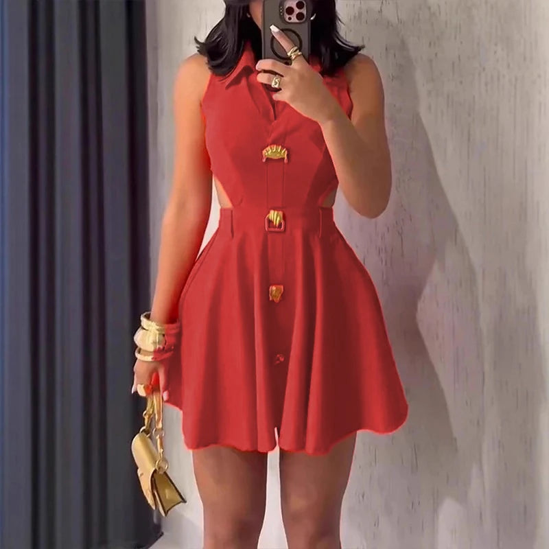 Person wearing a red dress with gold buttons taking a mirror selfie.