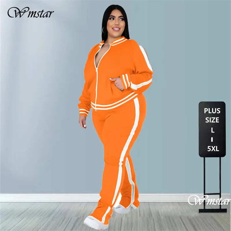 Woman wearing an orange tracksuit with white stripes 