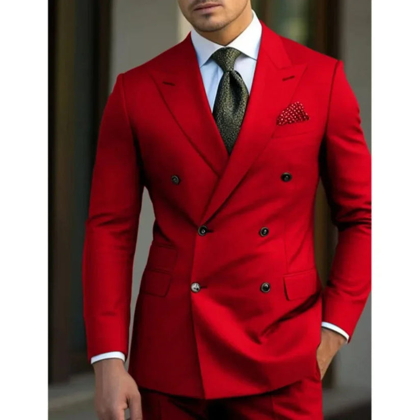 Man wearing a red suit with a white shirt and patterned tie.