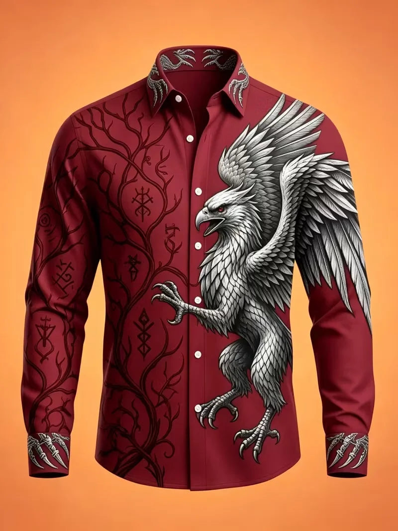 A long-sleeve button-up shirt in deep burgundy red, featuring a large black and white griffin graphic on the right side and black Norse-style runes and tree branch patterns on the left side and sleeves, set against a solid orange background.