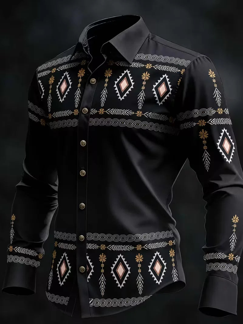 A black long-sleeve button-up shirt with intricate geometric and tribal-style embroidery in white, gold, and light pink, displayed on a dark background.