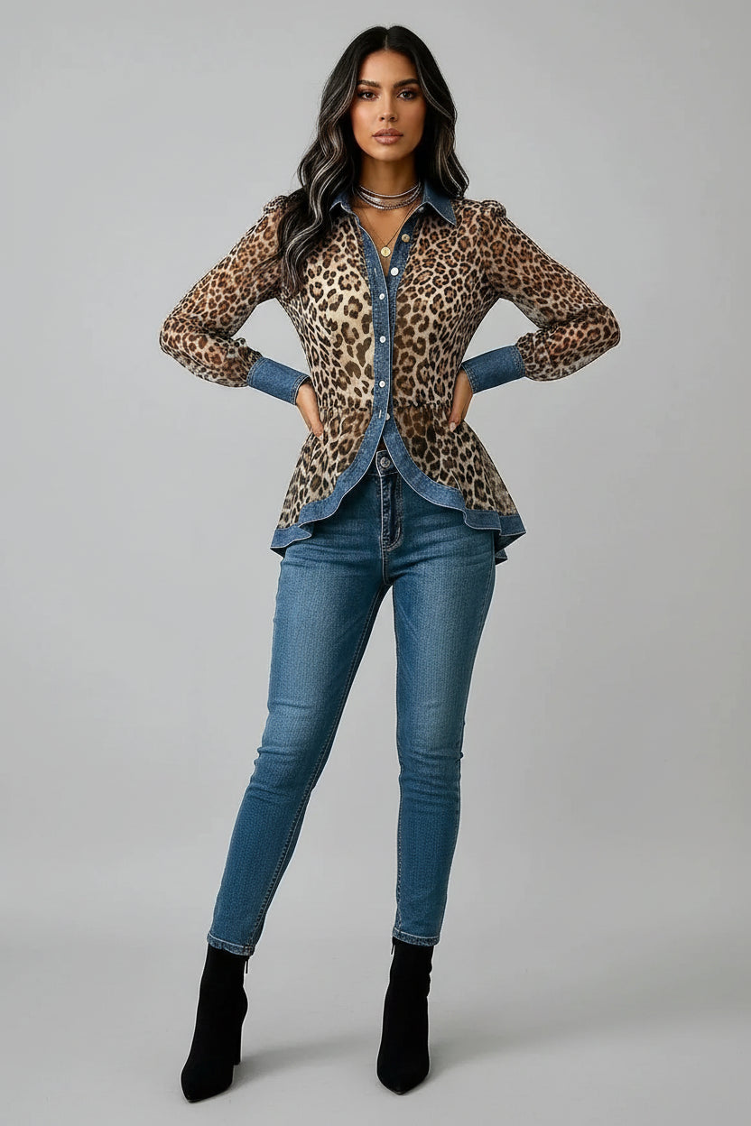 Leopard print blouse with denim collar and cuffs worn by a person on a gray background