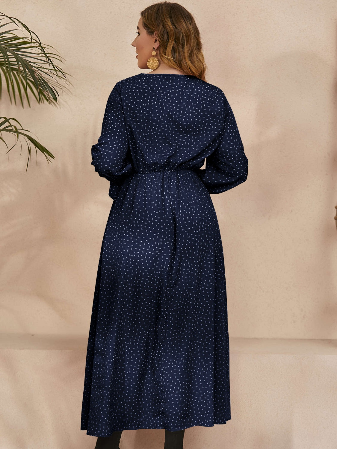 Back of Navy Ruffled Polka Dot Long Sleeve Midi Dress