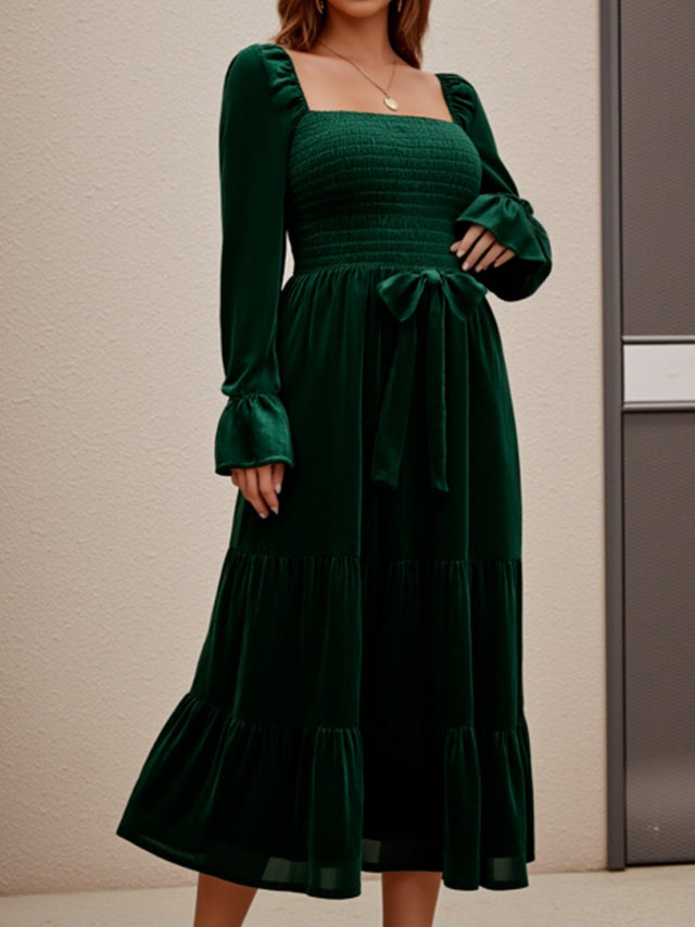 Green dress with long sleeves and a square neckline 
